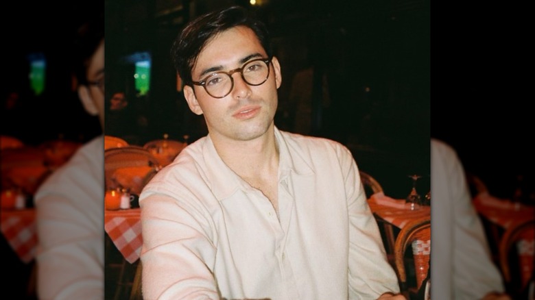 Harper Peck Voll posing in a restaurant.