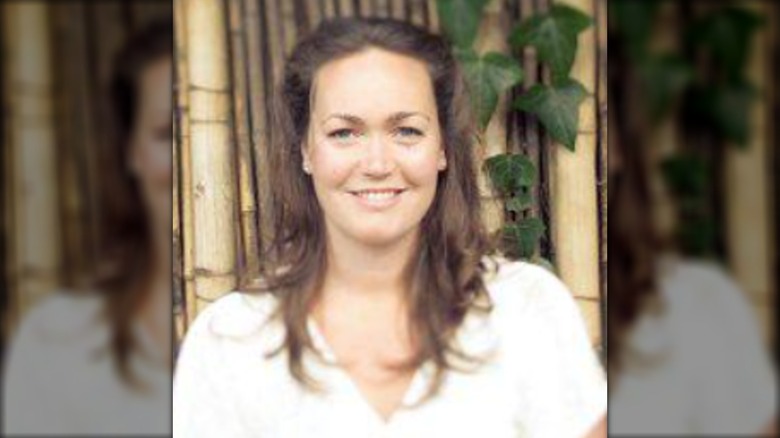 Marisa Peck Johnson smiling in a white shirt