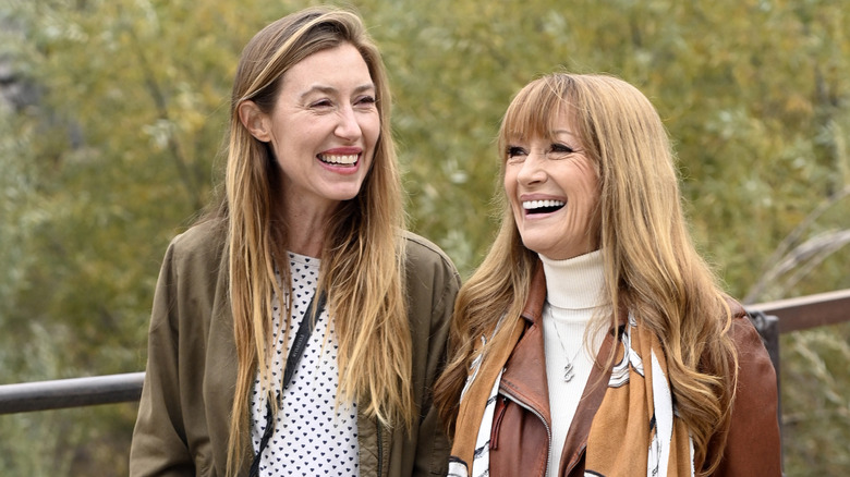 Katherine Flynn and Jane Seymour laughing outdoors at a 2021 charity event