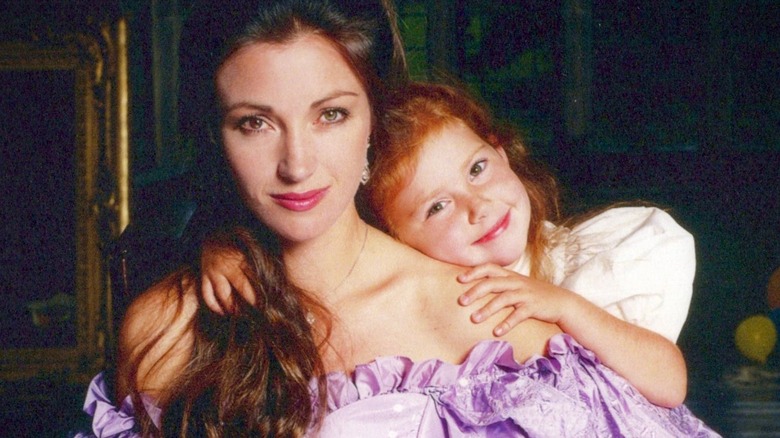 Jane Seymour and a young Katherine pose on a movie set