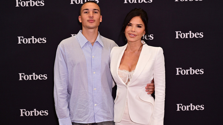 Nikko Gonzalez posing with Lauren Sanchez Bezos on the red carpet.