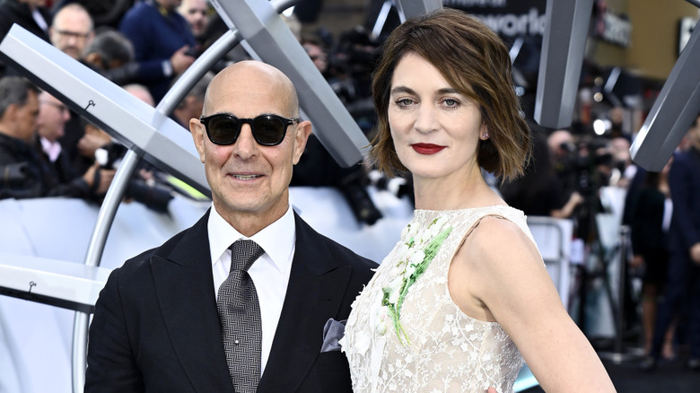 Felicity Blunt and Stanley Tucci pose on a 2026 red carpet.