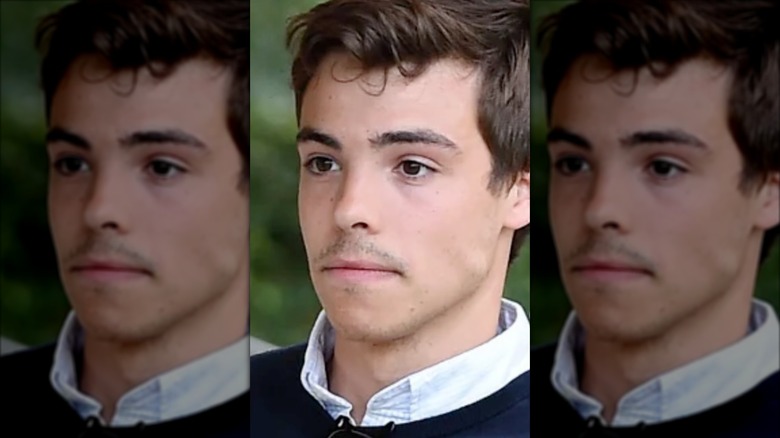 Nicolo Tucci looks off to the side.