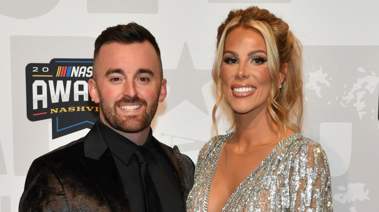 Austin and Whitney Dillon smiling together while wearing formal wear