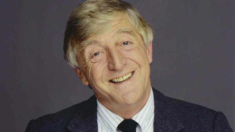 Michael Parkinson smiling in suit