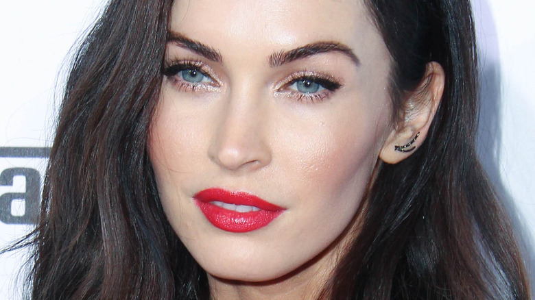 Megan Fox poses in red lipstick