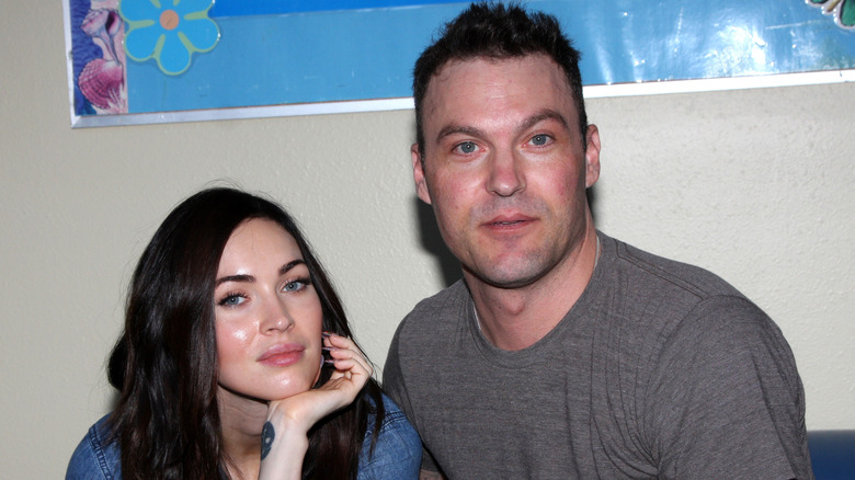 Megan Fox sitting next to Brian Austin Green