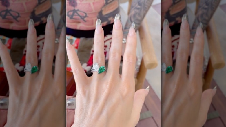 Megan Fox's hand wearing her engagement ring