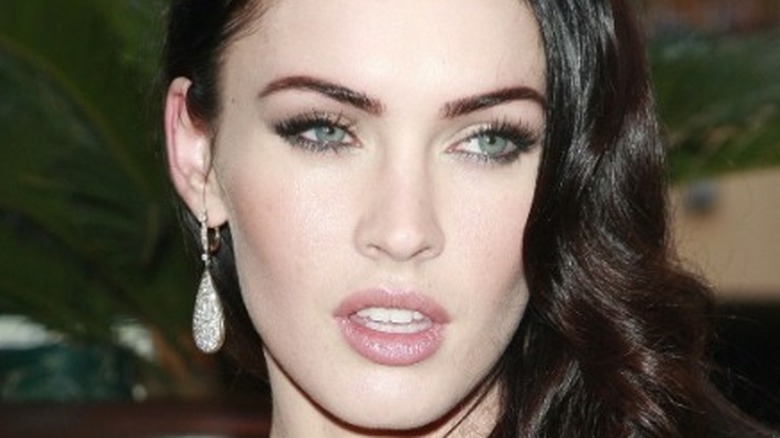Megan Fox wearing dangling earrings
