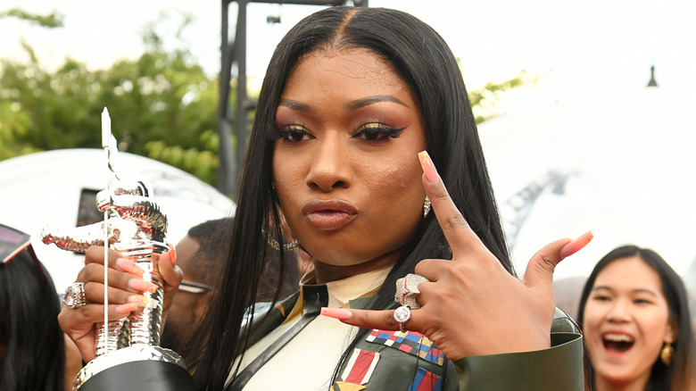 Megan Thee Stallion holding an MTV Video Music Award
