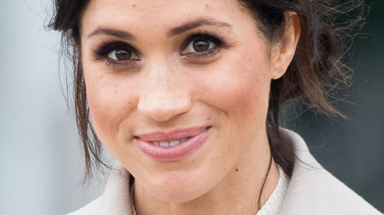 Meghan Markle, the Duchess of Sussex smiles at an event