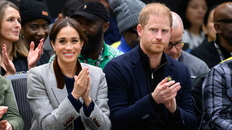 Meghan Markle and Prince Harry clap at the Invictus Games.