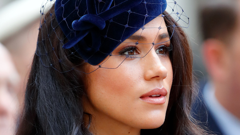 Meghan Markle wearing a blue headdress