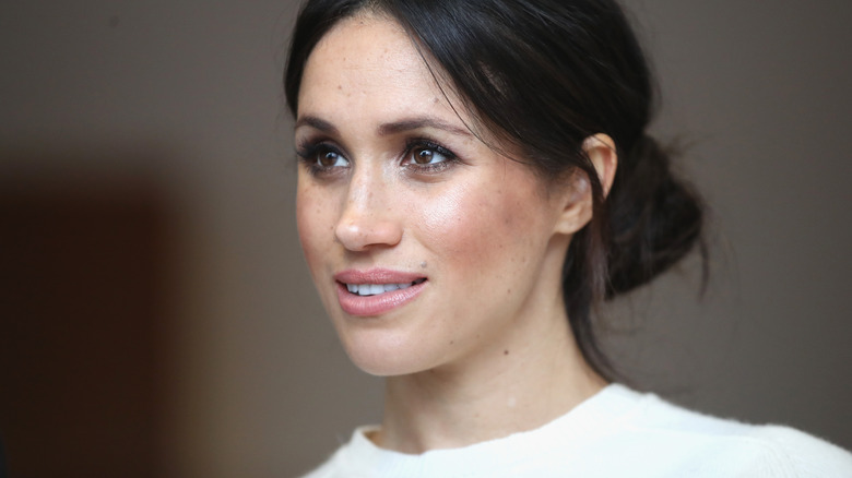 Meghan Markle white dress, smiling