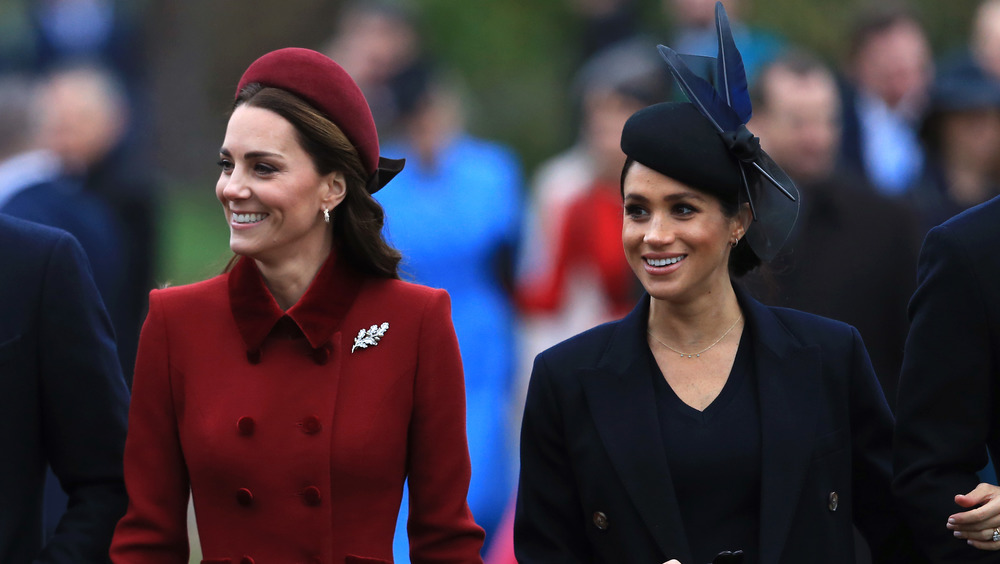 Kate Middleton & Meghan Markle at an event 