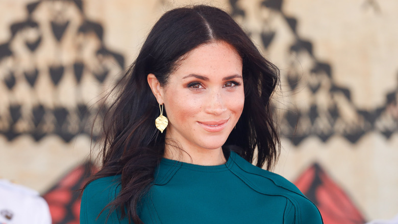 Meghan Markle blue dress smiling 