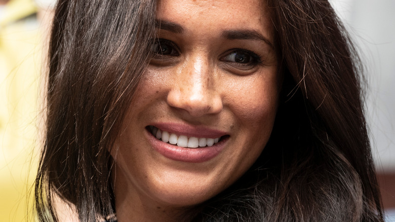 Meghan Markle smiling at an event