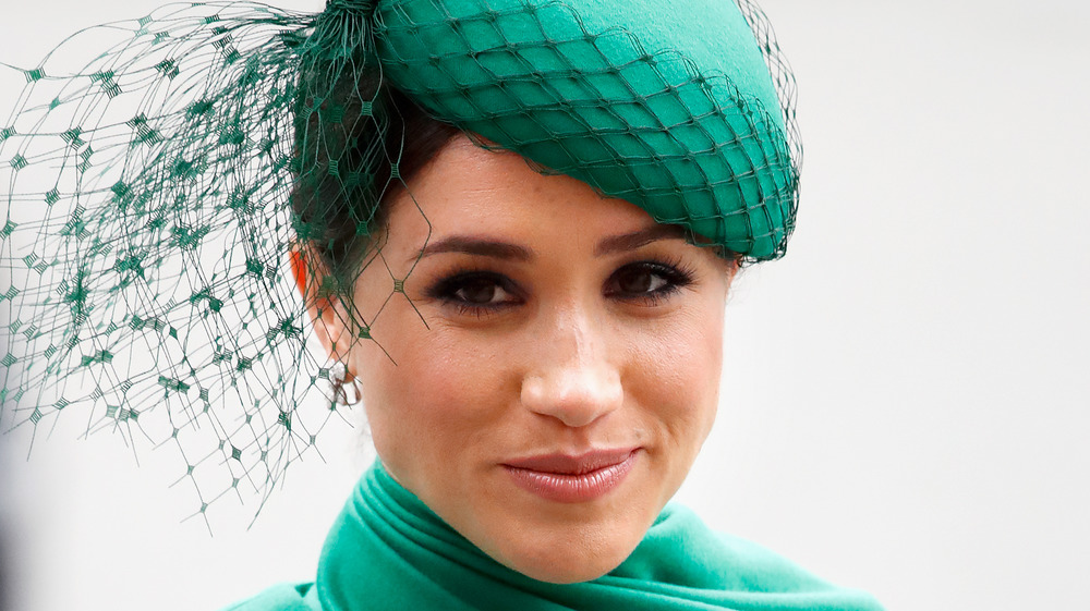 Meghan Markle wearing emerald green at an event 