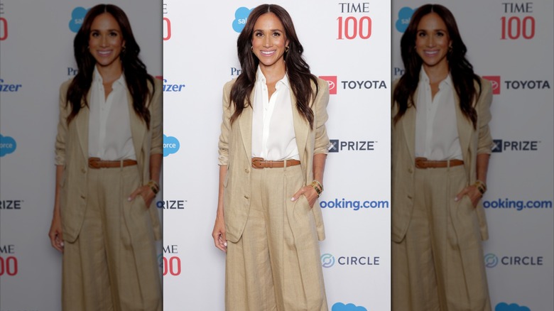Meghan Markle posing in a linen suit Time 100 summit