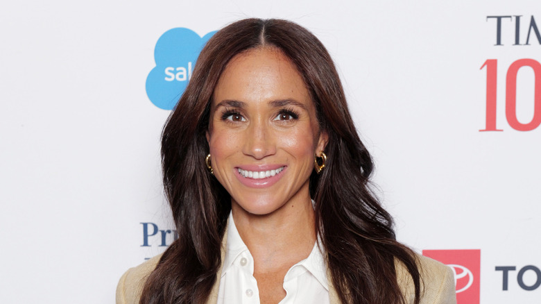 Meghan Markle smiling on red carpet