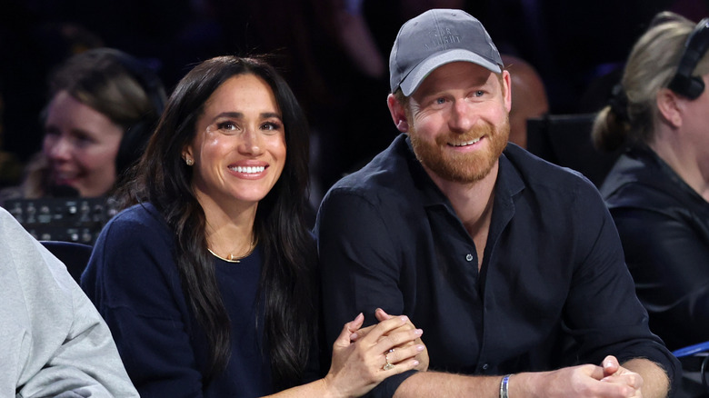 Meghan Markle and Prince Harry at a basketball game