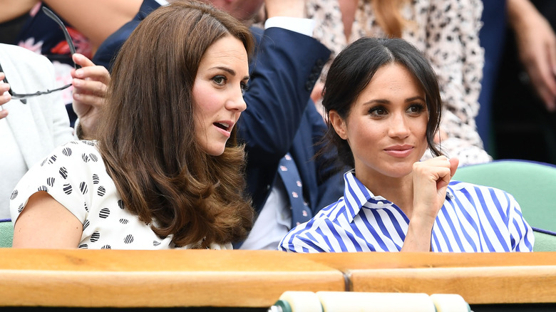 Kate Middleton and Meghan Markle talking