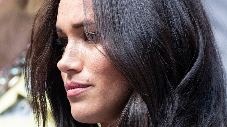 Meghan Markle watches an event