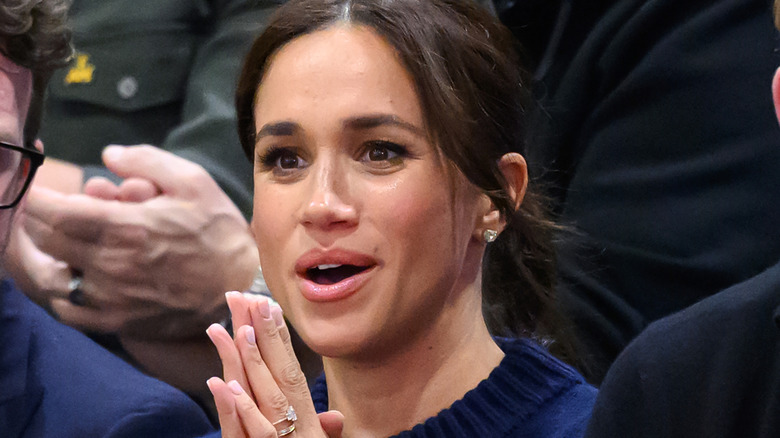 Meghan Markle clasping her hands