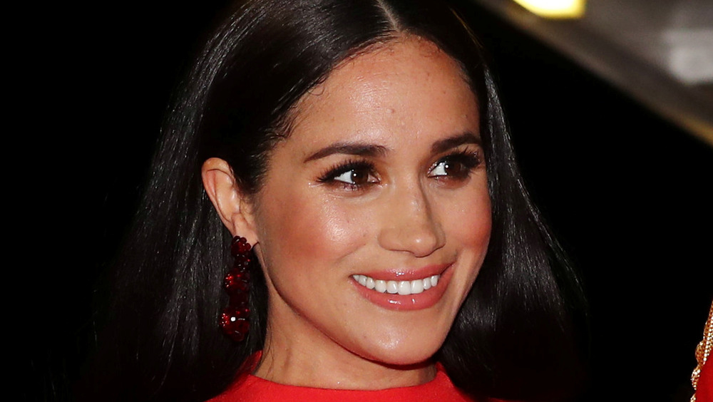 Meghan Markle smiles during a public outing