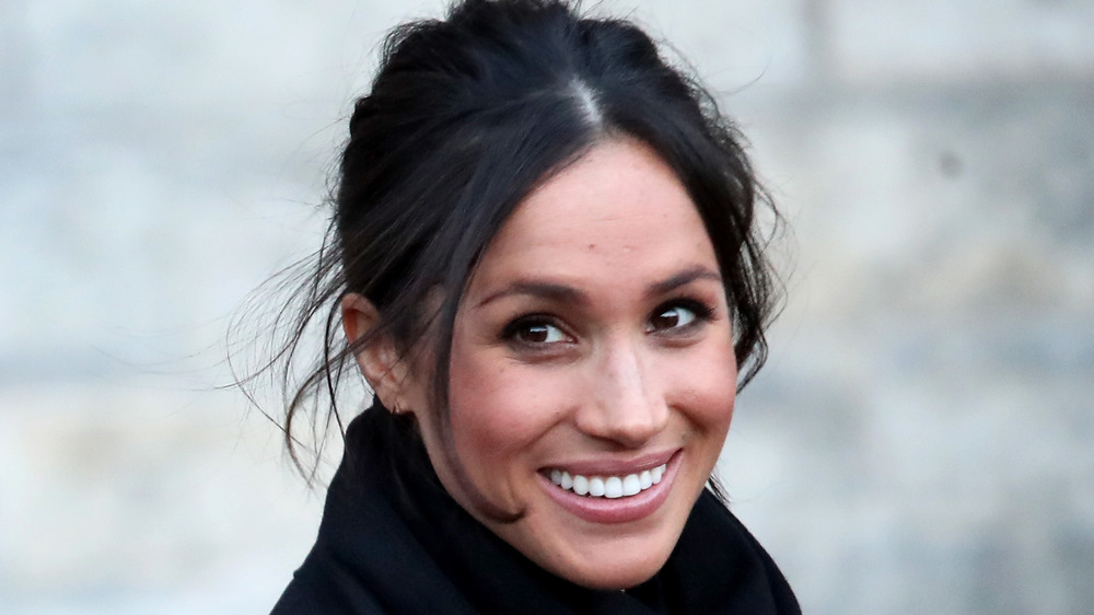 Meghan Markle smiling for the cameras