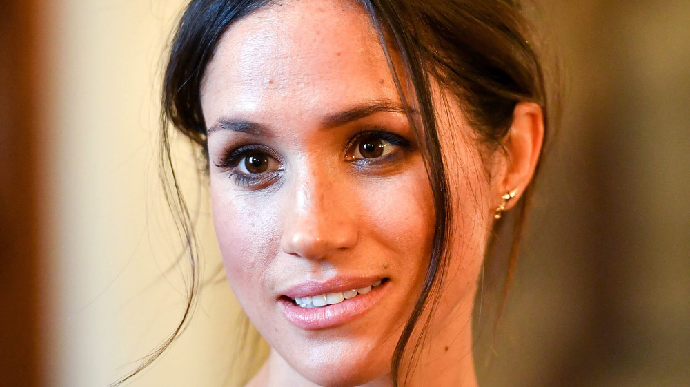 Meghan Markle gives a pensive look while on royal duties