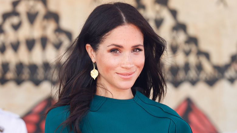 Meghan Markle wearing a green dress