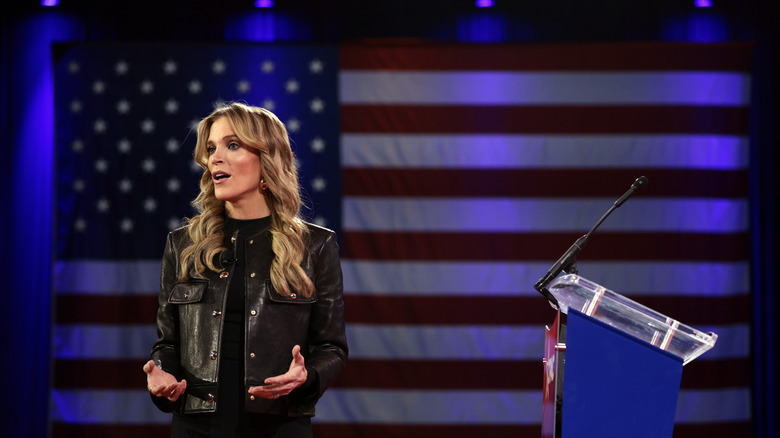 Megyn Kelly in front of an American flag