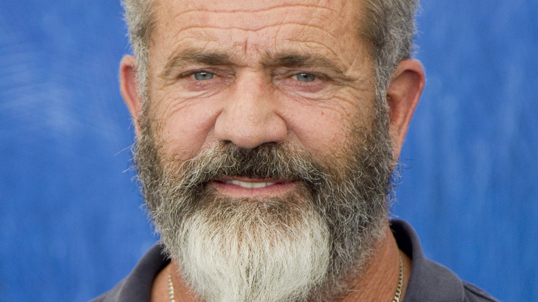 Mel Gibson long gray beard gold necklace