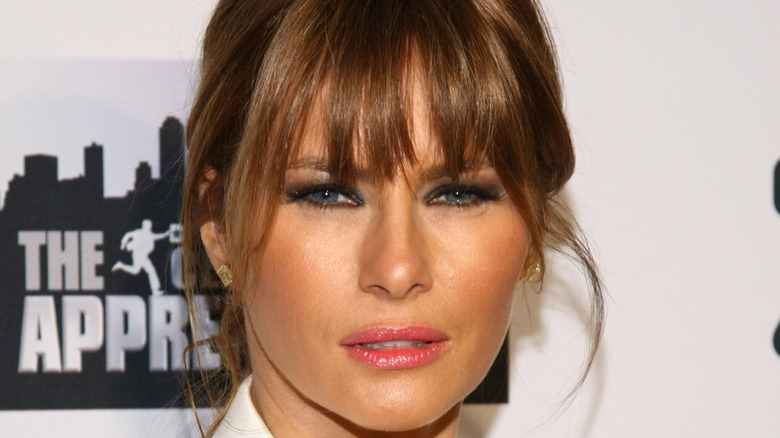 Melania Trump poses on the red carpet at a "Celebrity Apprentice" event