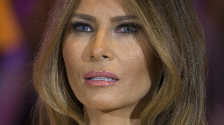 Melania Trump posing with hair in face