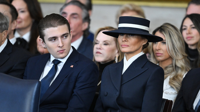 Barron Trump sits next to mother Melania Trump