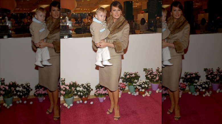 Melania Trump in brown coordinates and a baby Barron Trump