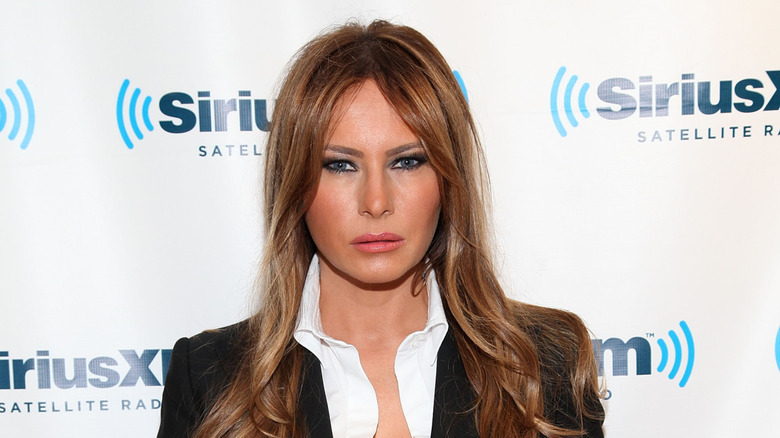 Melania Trump, pursing her lips