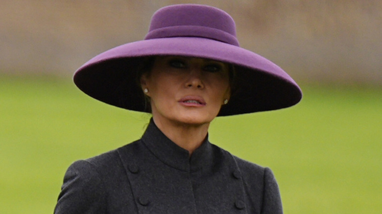 Melania Trump wearing a big purple hat