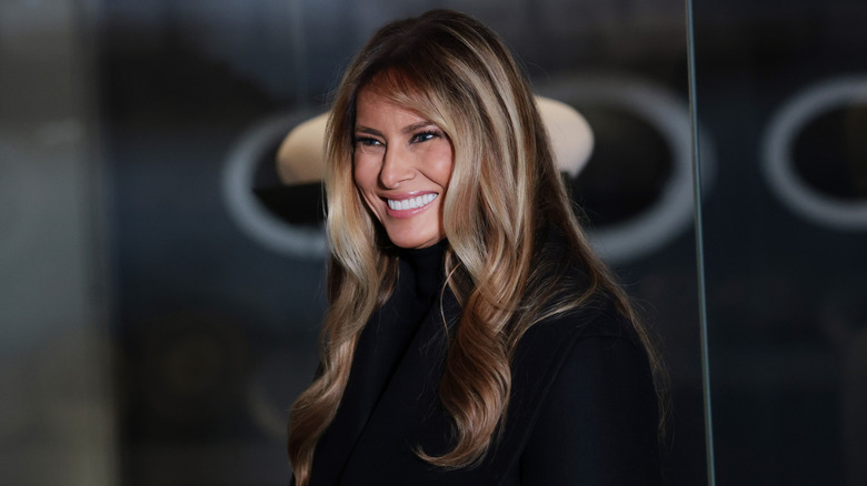 Melania Trump smiling in black