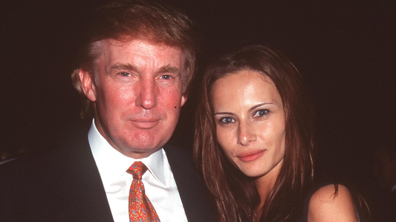 Donald and Melania Trump posing in 1998
