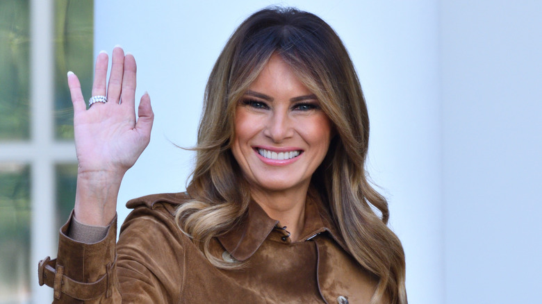 Melania Trump smiling and waving