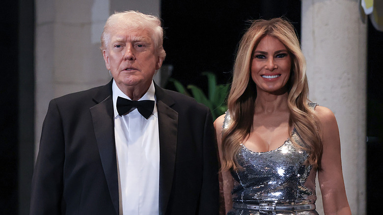 Donald and Melania Trump attend a holiday party in black tie outfits