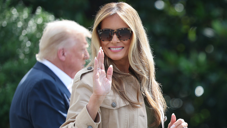 Melania Trump smiling with sunglasses on and blonder hair