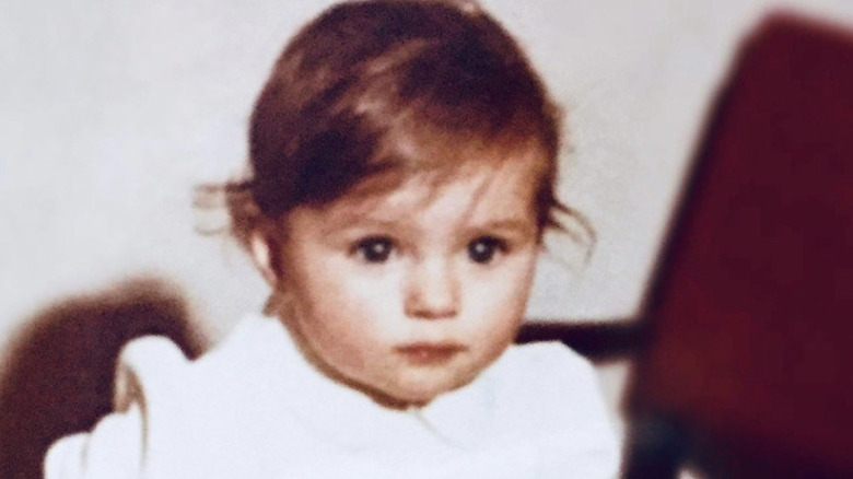 Melania Trump as a baby with dark hair