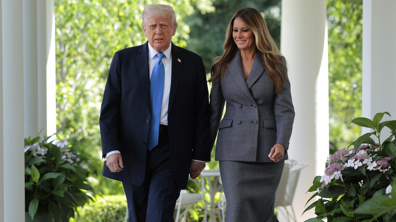 Melania Trump smiling at Donald Trump