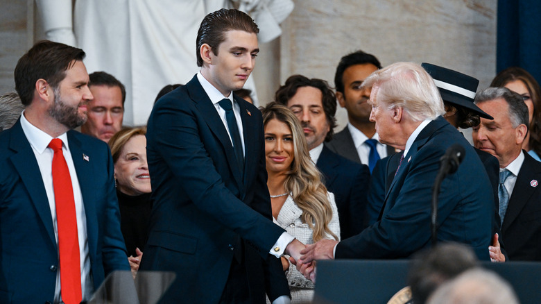 Barron Trump shaking hands with Donald Trump at Donald's inauguration