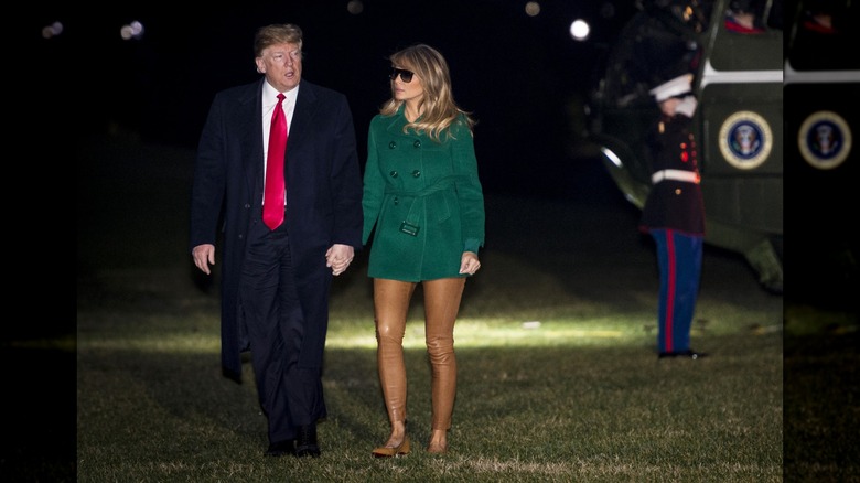 Donald and Melania Trump holding hands