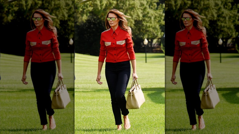 Melania Trump wearing a red shirt